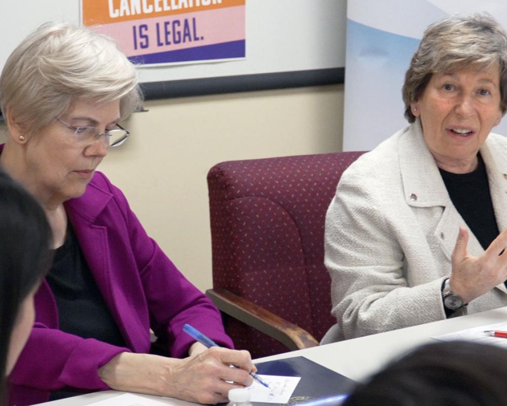 Weingarten, right, with Sen. Elizabeth Warren at a discussion in Boston on March 18 about the student debt crisis. Credit: Adam Derstine